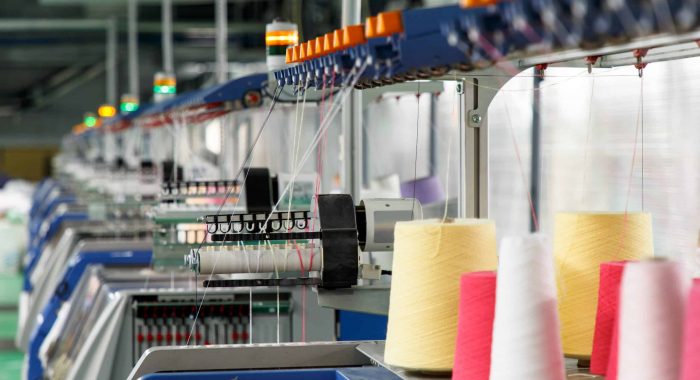 Textile industry with knitting machines in factory