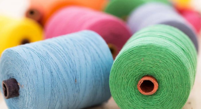 Tailoring. Many colorful threads on the table