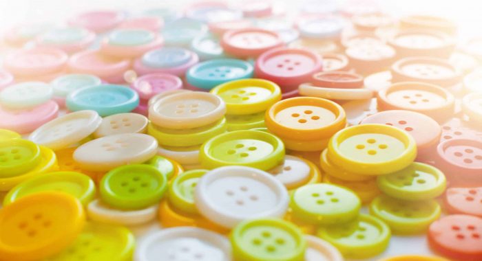 Many Colorful Sewing buttons. Bright background