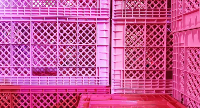 Full Frame Background of Pile of Pink Plastic Baskets