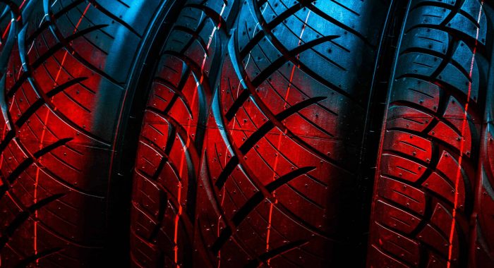 New tyres background. Car tyres close up
