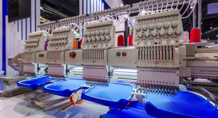 Textile - Professional and industrial embroidery machine. Machine embroidery is an embroidery process whereby a sewing machine or embroidery machine is used to create patterns on textiles.