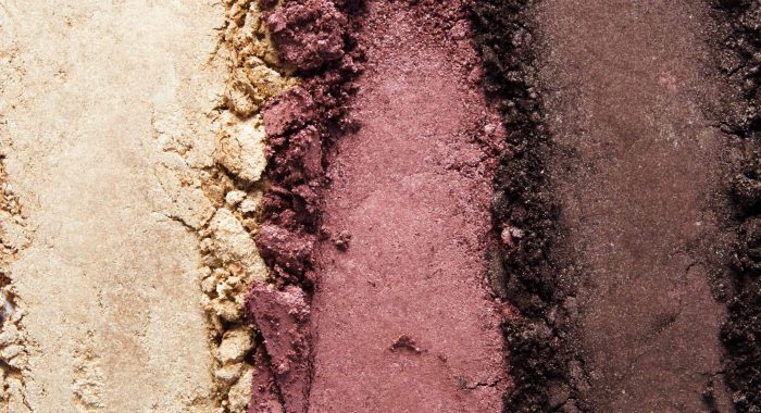 Texture of broken eyeshadow or powder. The concept of fashion and beauty industry. Close-up. - Image