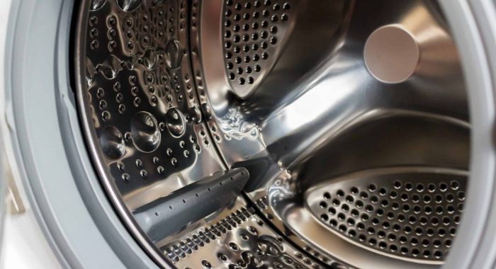 Close-up photo of empty washing machine tank.