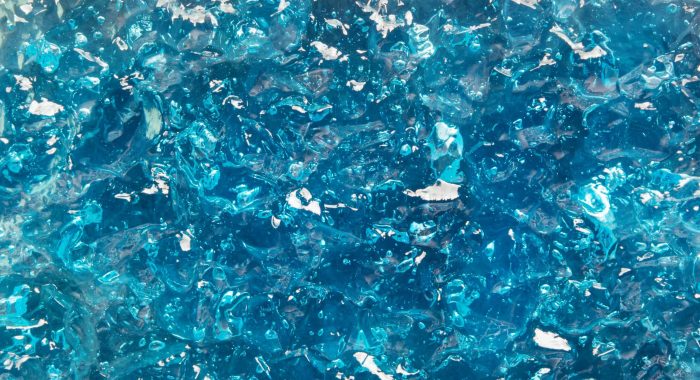 Cosmetic gel texture. Aqua blue shiny jelly background
