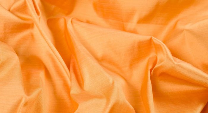 Abstract background luxury silk yellow fabric, drapery, texture, background, pattern