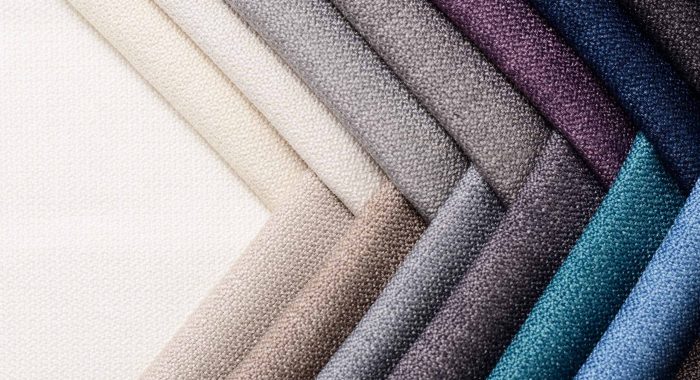 Bright collection of gunny textile samples. Multicolor Fabric texture background.