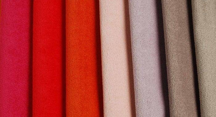 Bright collection of colorful velour textile samples. Fabric texture background