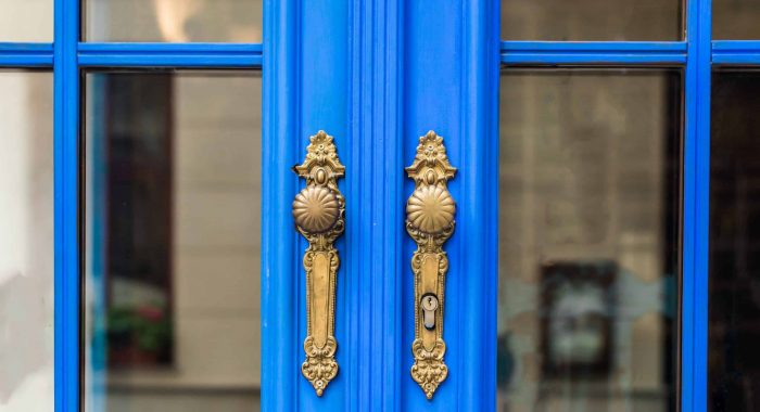 Old wooden entrance door with antique door handle