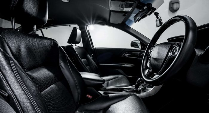 Clean console modern car, black indoor design.