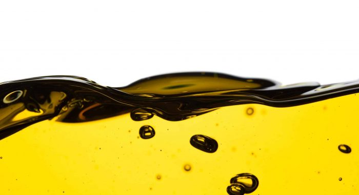 Pouring oil car motor or olive vegetable cooking and bubble isolated on white background