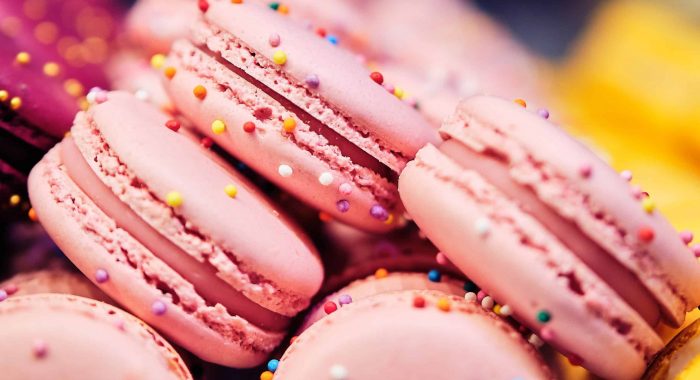Delicious and beautiful pink, macaroons on sale. Close up. square format