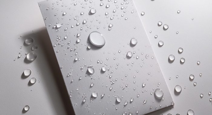 Create an image of a postcard with water droplets scattered on a white surface